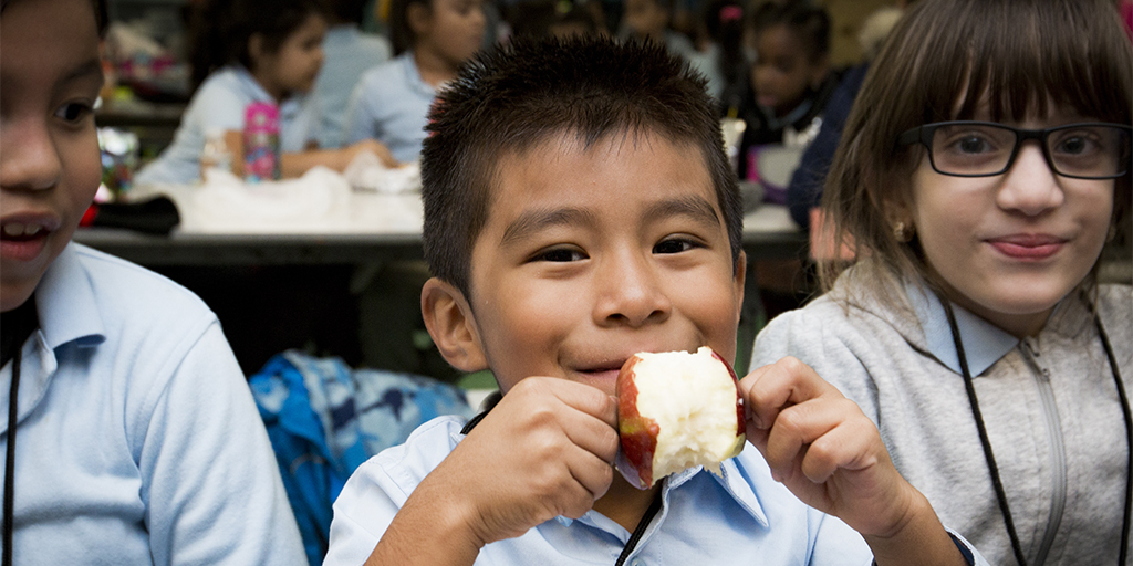 |children with food|smiling girl