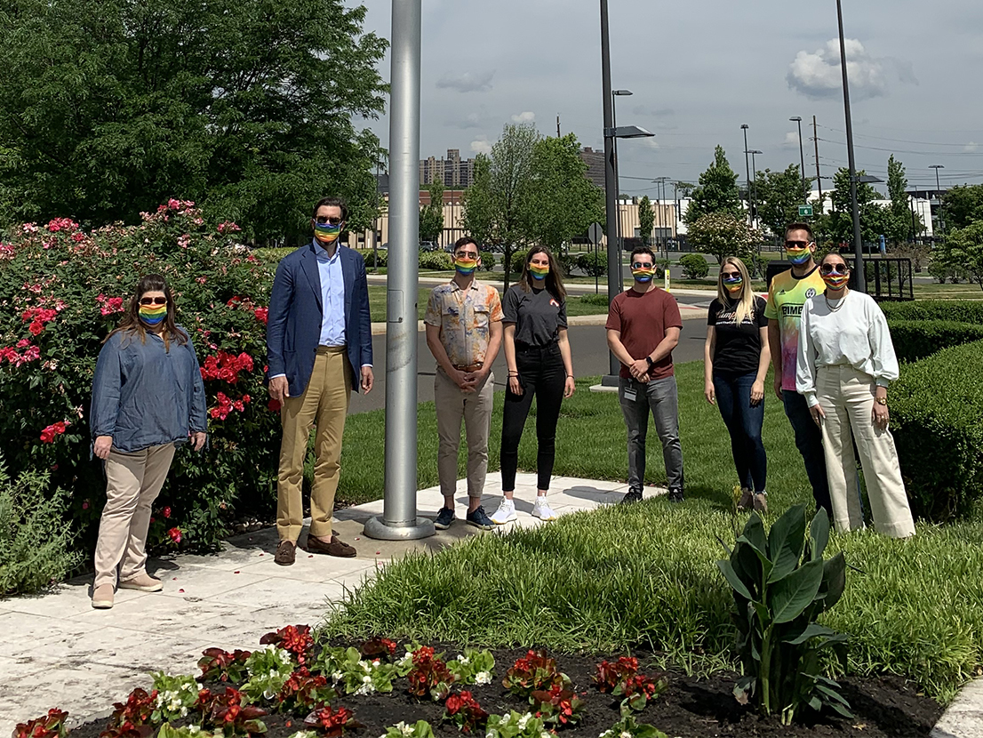 employees at pride flag raising