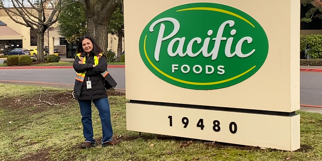 julia lewis in front of pacific foods sign