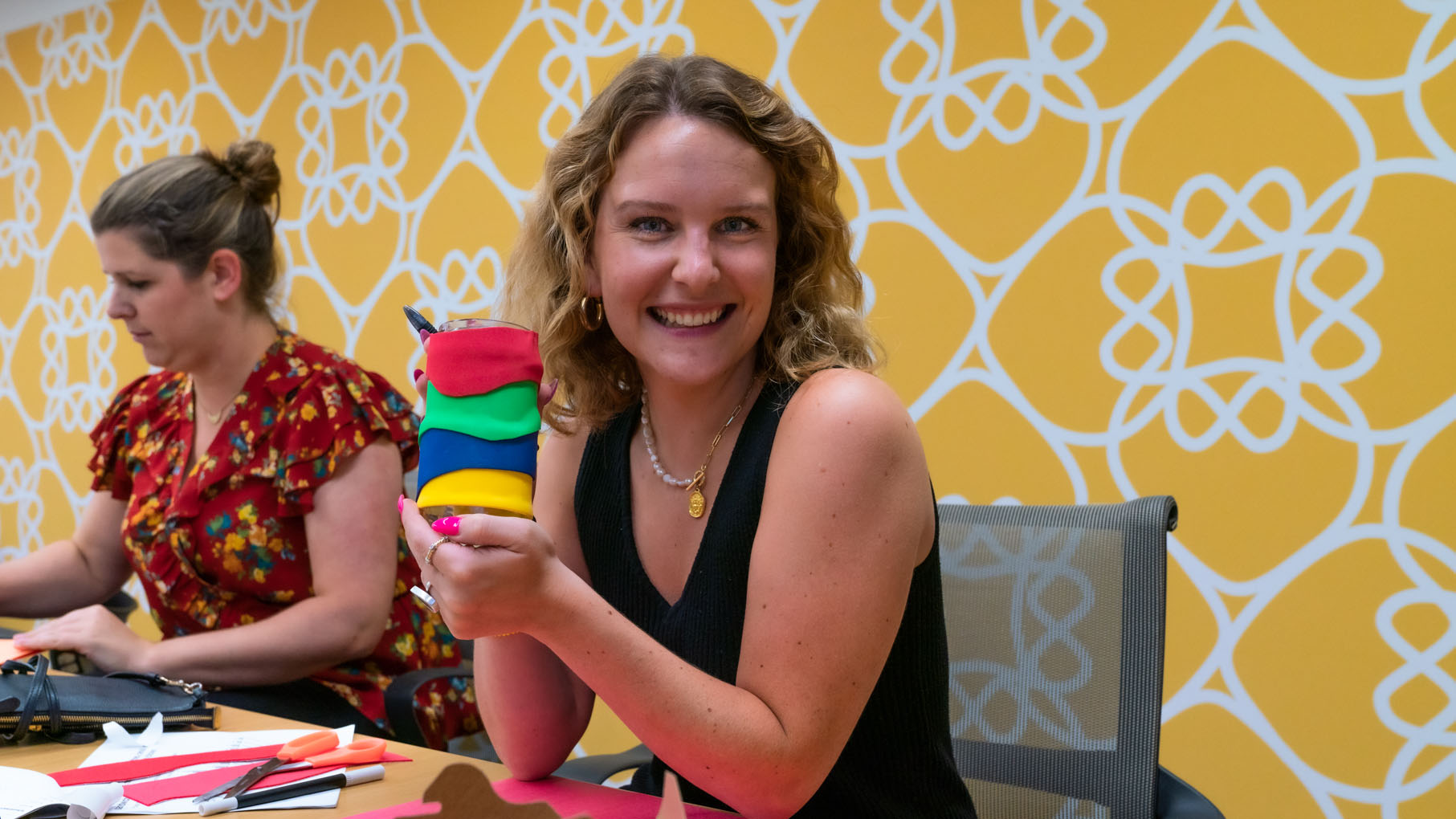 employee holding initial design of product