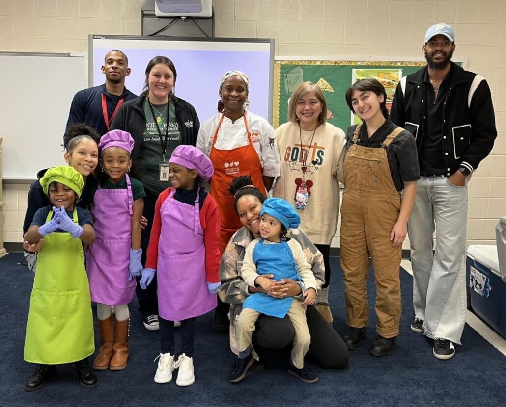 Full Futures cooking class poses for photo in classroom