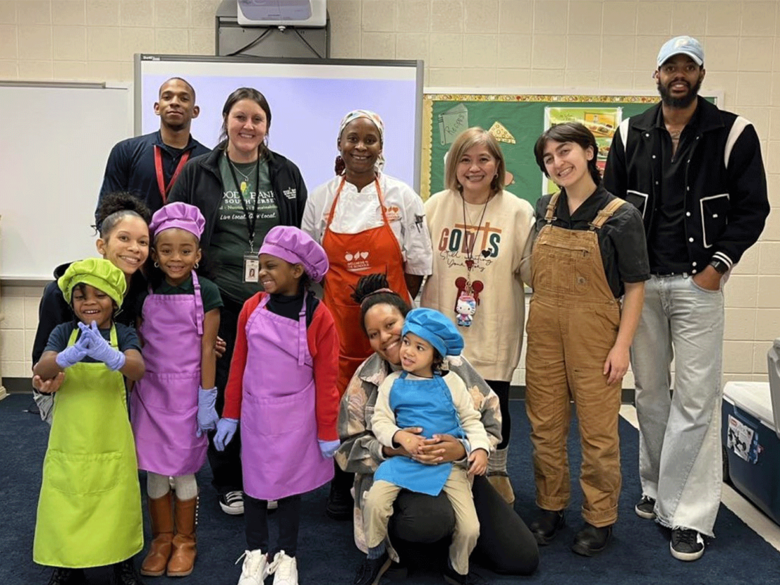Full Futures cooking class poses for photo in classroom
