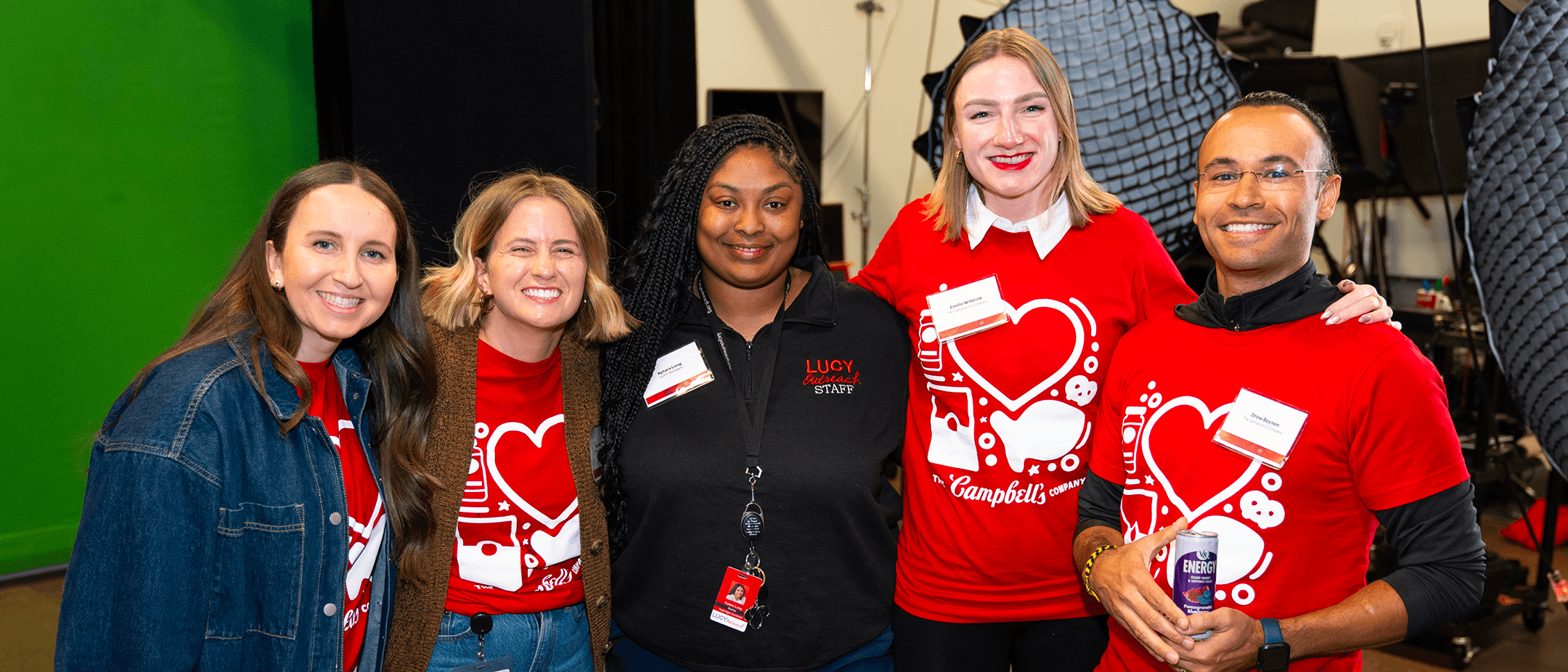 Campbell's employee volunteers pose with LUCY Outreach staff members