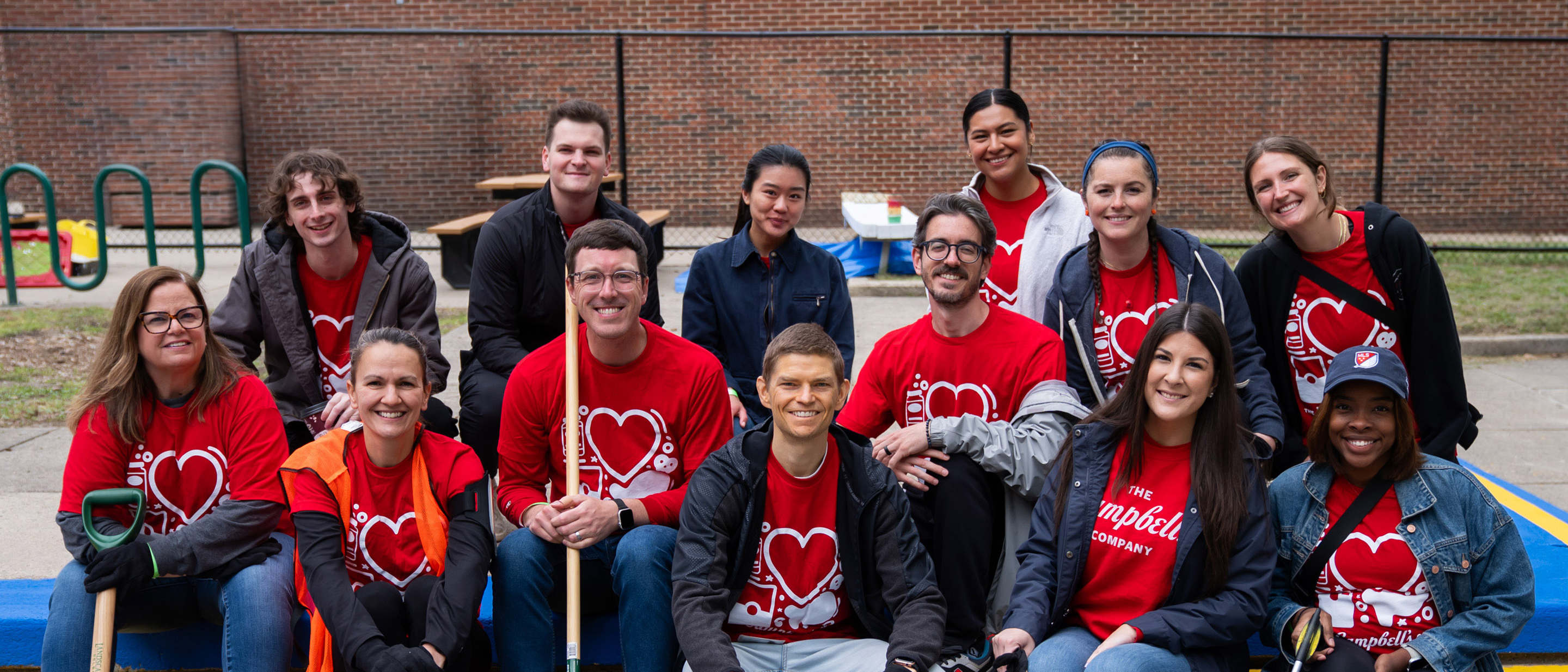 Employee volunteers from The Campbell's Company pose for a picture at a park clean-up during Days of Service 2026
