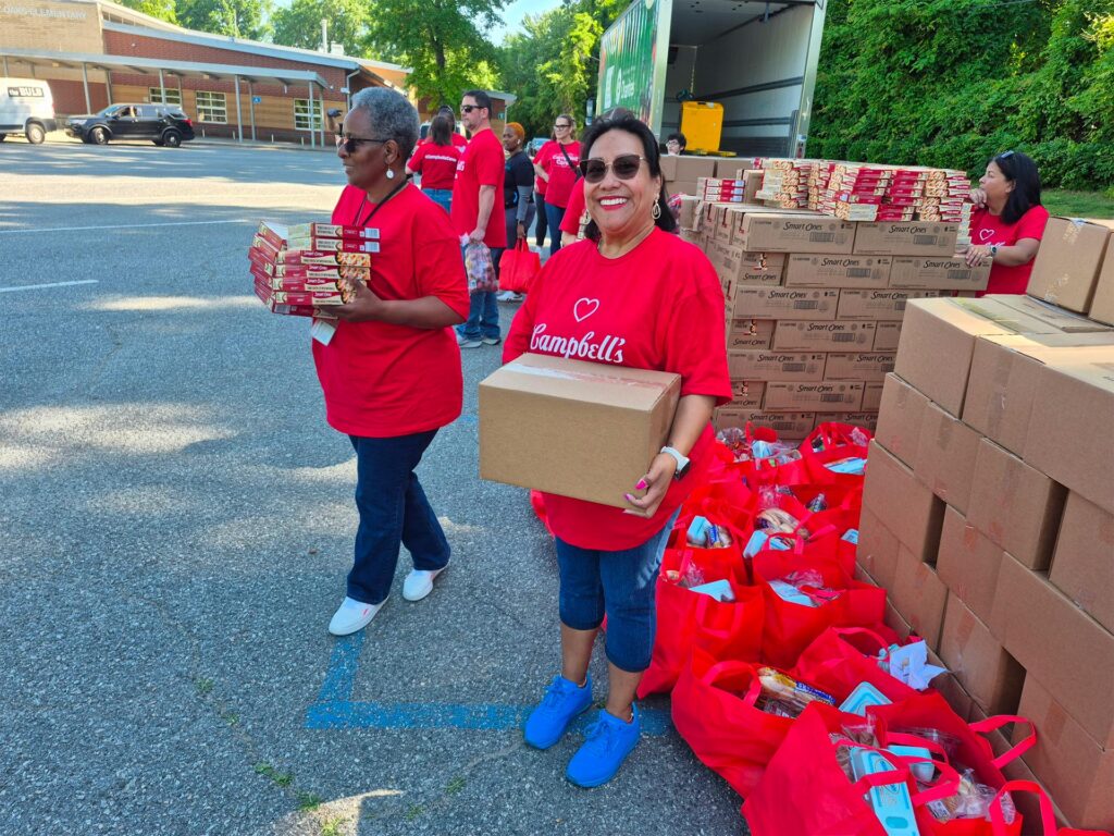 Employees sorting and packing food donations.