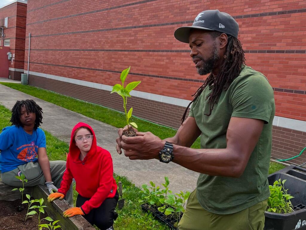 Students learning how to plant vegetables.
