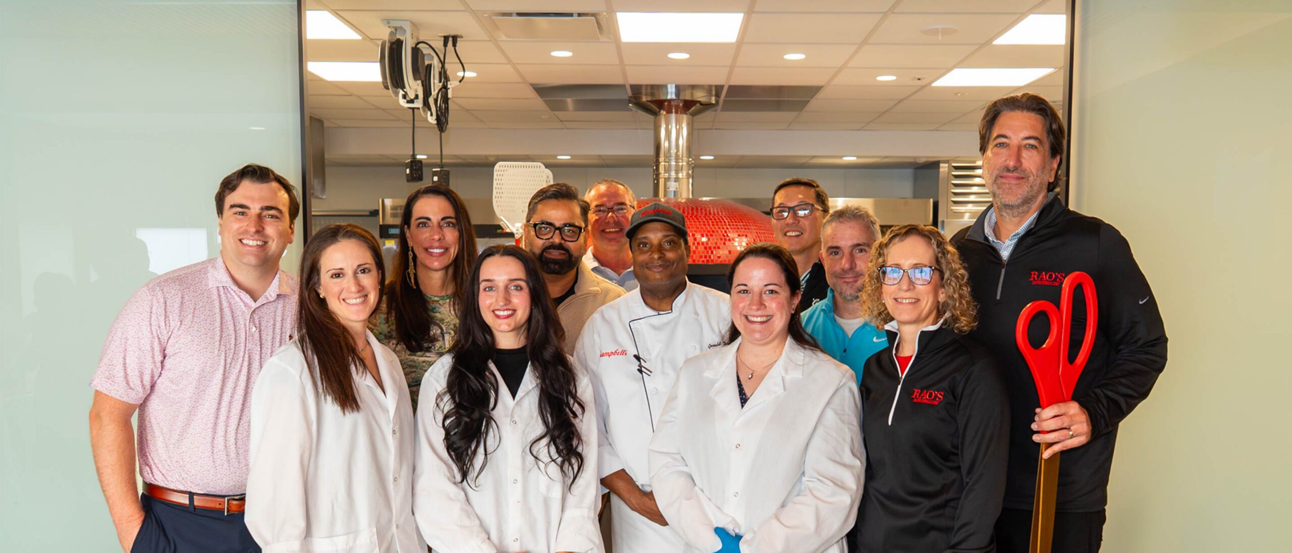 Chefs and Employees at the ribbon cutting of the new R&D kitchen